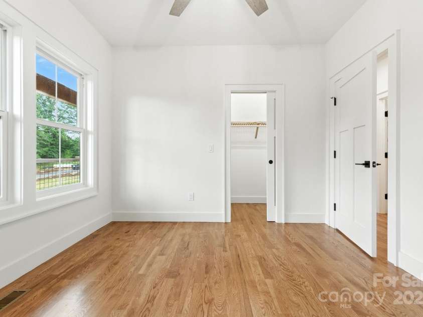 82 Lillycrop Lane, Hendersonville, NC 28792.  MLS# CAR4273359, YatesRealty ID 30864. Closet with pocket door in front bedroom