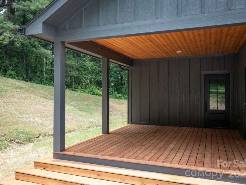 82 Lillycrop Lane, Hendersonville, NC 28792.  MLS# CAR4273359, YatesRealty ID 30864. Covered back deck extends your living space outdoors