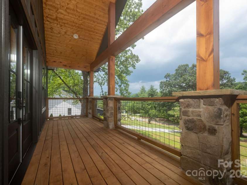 82 Lillycrop Lane, Hendersonville, NC 28792.  MLS# CAR4273359, YatesRealty ID 30864. Enjoy evenings on a stunning front porch