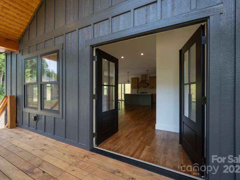 82 Lillycrop Lane, Hendersonville, NC 28792.  MLS# CAR4273359, YatesRealty ID 30864. Inviting entryway featuring French doors for a touch of classic style