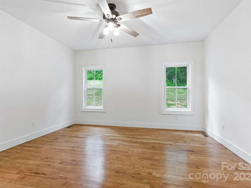 82 Lillycrop Lane, Hendersonville, NC 28792.  MLS# CAR4273359, YatesRealty ID 30864. Large windows flood space with natural light