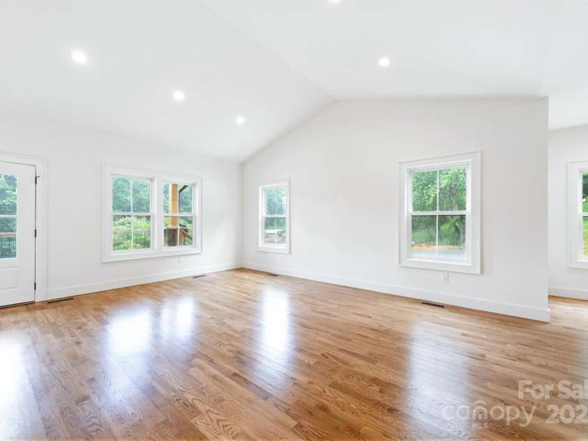 82 Lillycrop Lane, Hendersonville, NC 28792.  MLS# CAR4273359, YatesRealty ID 30864. Lots of windows bring ample natural light to living room