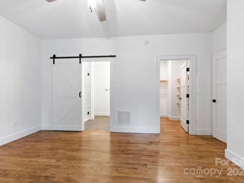 82 Lillycrop Lane, Hendersonville, NC 28792.  MLS# CAR4273359, YatesRealty ID 30864. Primary bedroom features en suite and walk-in closet