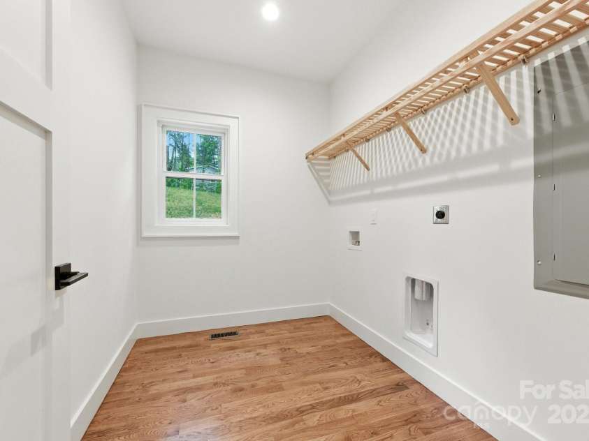82 Lillycrop Lane, Hendersonville, NC 28792.  MLS# CAR4273359, YatesRealty ID 30864. Sizable laundry room