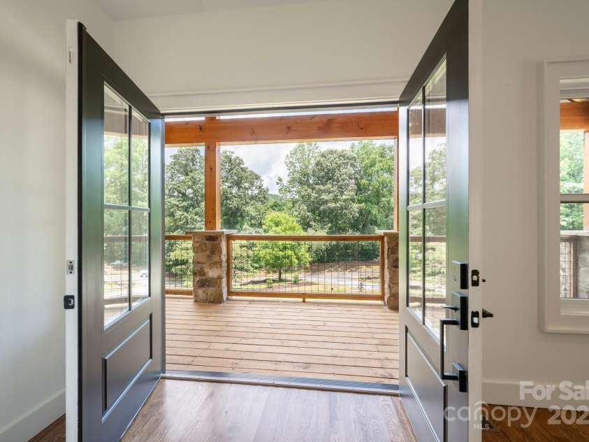 82 Lillycrop Lane, Hendersonville, NC 28792.  MLS# CAR4273359, YatesRealty ID 30864. Stylish front entry enhanced by beautiful French doors