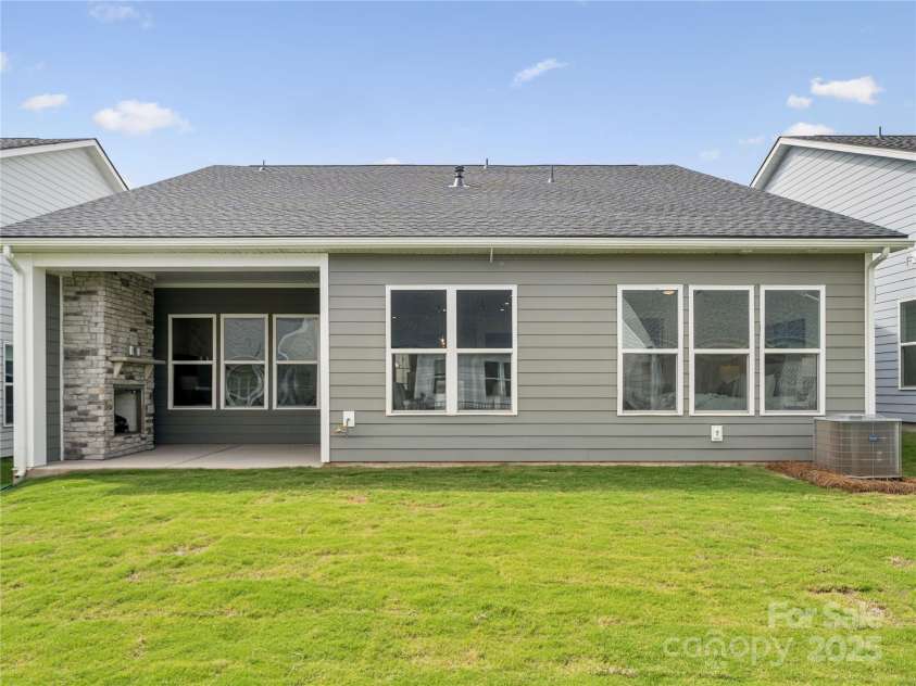5343 Mint Harbor Way, Charlotte, NC 28269.  MLS# CAR4288565, YatesRealty ID 30867. Rear of home with exterior gas fireplace