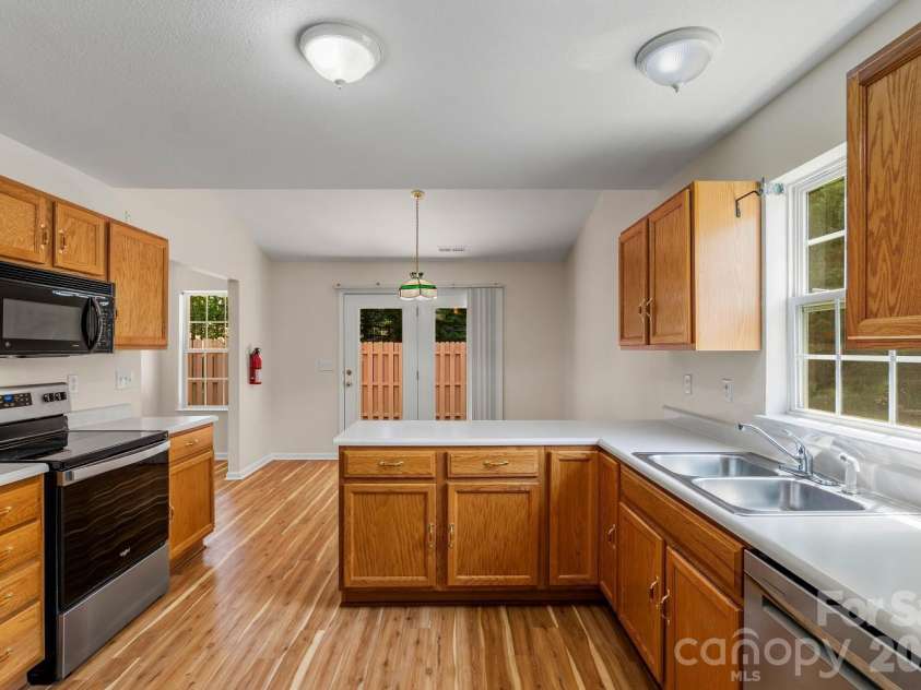 308 Wiltshire Circle, Fletcher, NC 28732.  MLS# CAR4389332, YatesRealty ID 30869. Bright, sunny kitchen. Plenty of counter and cabinet space.
