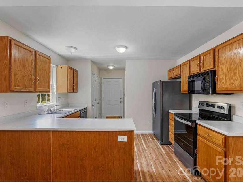 308 Wiltshire Circle, Fletcher, NC 28732.  MLS# CAR4389332, YatesRealty ID 30869. Direct access to laundry room, pantry and two-car garage.