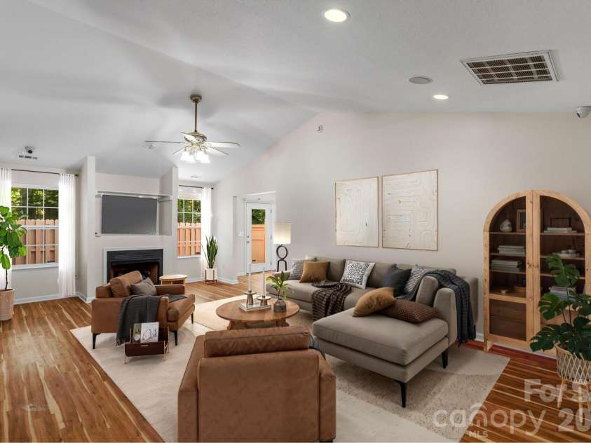 308 Wiltshire Circle, Fletcher, NC 28732.  MLS# CAR4389332, YatesRealty ID 30869. Large living room  with fireplace (image has been virtually staged)