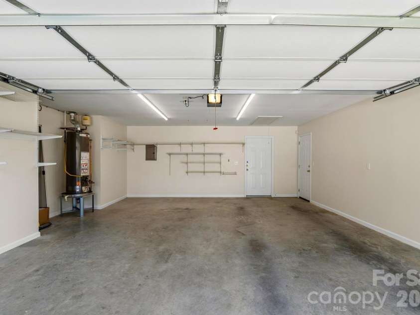 308 Wiltshire Circle, Fletcher, NC 28732.  MLS# CAR4389332, YatesRealty ID 30869. Two-car garage also has a side door entrance.