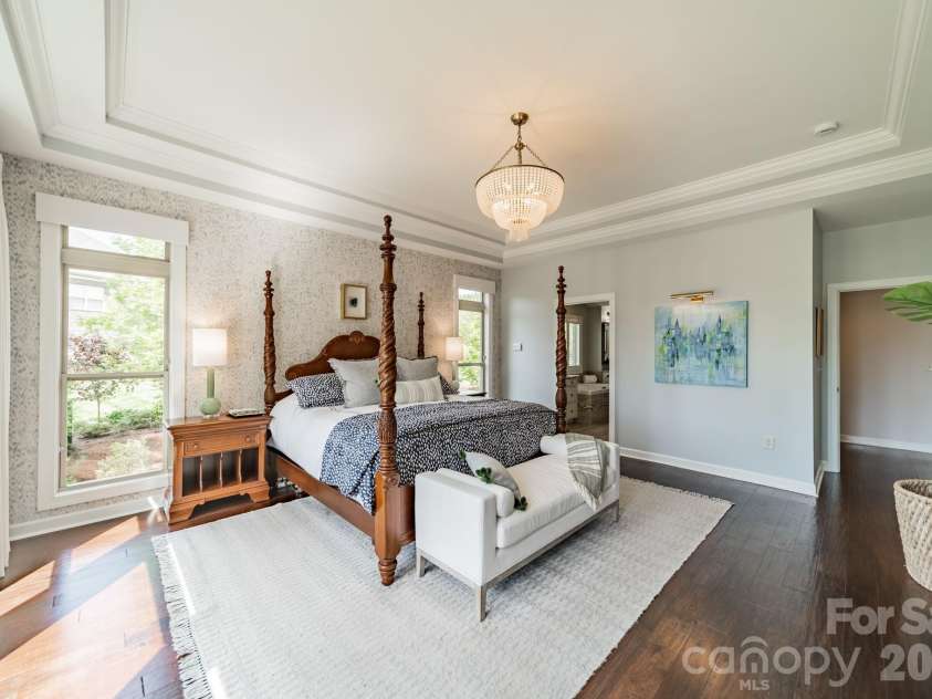 701 Copper Tree Lane, Waxhaw, NC 28173.  MLS# CAR4378056, YatesRealty ID 30870. Double tray ceilings and windows with transoms providing natural light and overlooking the resort-style backyard 