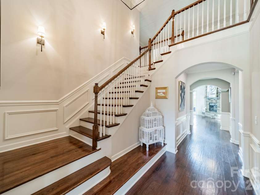 701 Copper Tree Lane, Waxhaw, NC 28173.  MLS# CAR4378056, YatesRealty ID 30870. Dramatic staircase with moldings and designer lighting