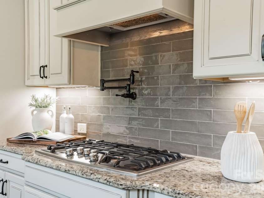 701 Copper Tree Lane, Waxhaw, NC 28173.  MLS# CAR4378056, YatesRealty ID 30870. Gas cooktop and convenient pot filler. 