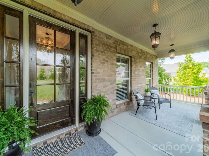 701 Copper Tree Lane, Waxhaw, NC 28173.  MLS# CAR4378056, YatesRealty ID 30870. Rocking chair front porch