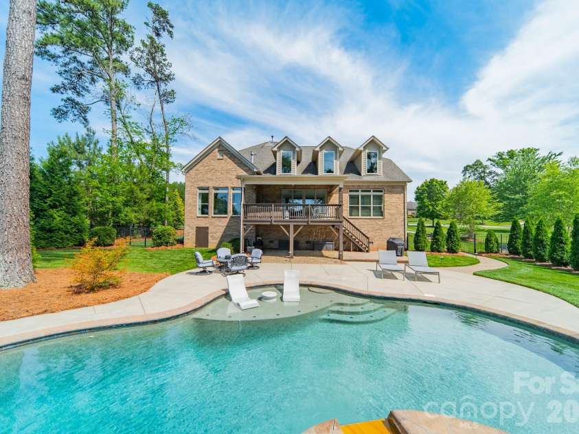 701 Copper Tree Lane, Waxhaw, NC 28173.  MLS# CAR4378056, YatesRealty ID 30870. Saltwater pool and spa with a tanning ledge