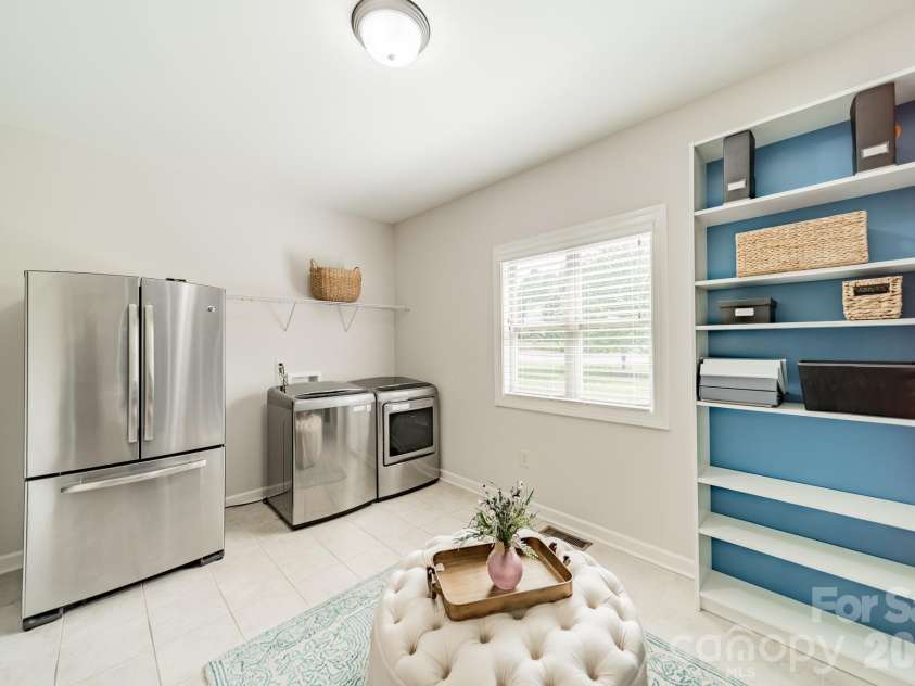 701 Copper Tree Lane, Waxhaw, NC 28173.  MLS# CAR4378056, YatesRealty ID 30870. Spacious multi-purpose mudroom with laundry space, room for an additional refrigerator and multiple storage options