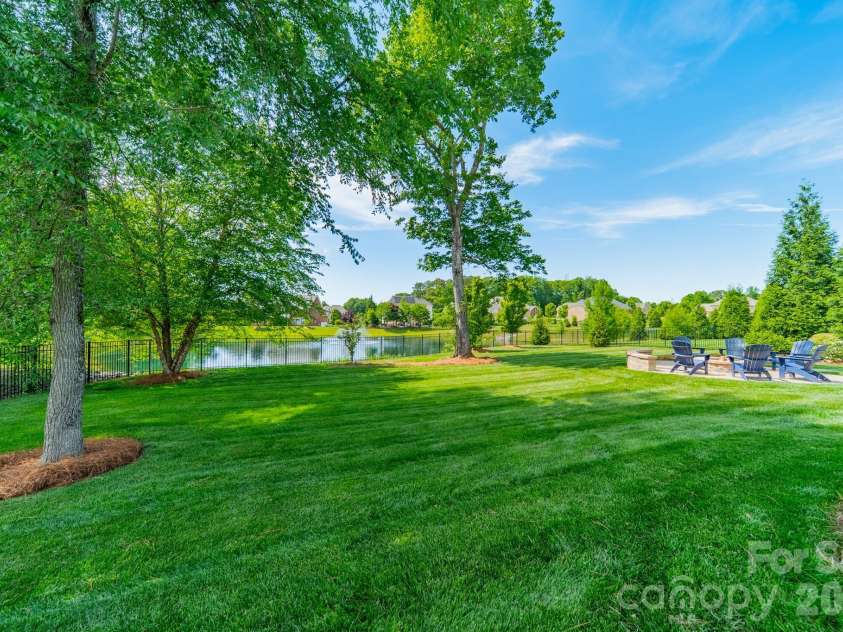 701 Copper Tree Lane, Waxhaw, NC 28173.  MLS# CAR4378056, YatesRealty ID 30870. Spacious park-like backyard retreat