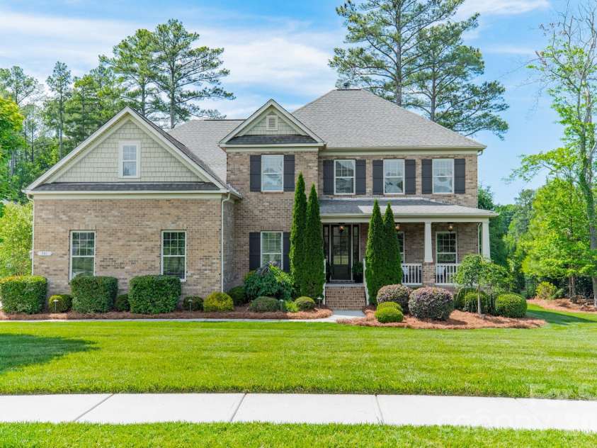 701 Copper Tree Lane, Waxhaw, NC 28173.  MLS# CAR4378056, YatesRealty ID 30870. Stately home with rocking chair front porch