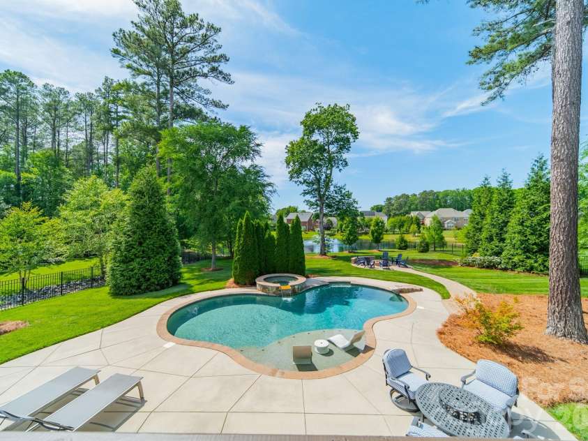 701 Copper Tree Lane, Waxhaw, NC 28173.  MLS# CAR4378056, YatesRealty ID 30870. Stunning backyard views of the pool and the pond.