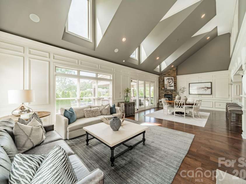 701 Copper Tree Lane, Waxhaw, NC 28173.  MLS# CAR4378056, YatesRealty ID 30870. The great room is anchored by two stacked stone fireplaces