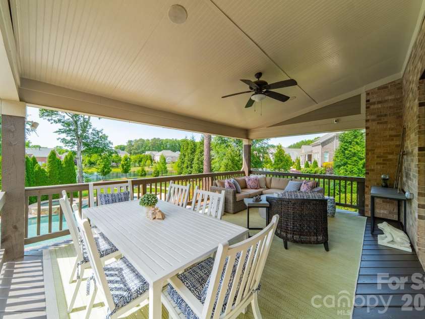 701 Copper Tree Lane, Waxhaw, NC 28173.  MLS# CAR4378056, YatesRealty ID 30870. The spacious rear porch overlooking the fantastic backyard