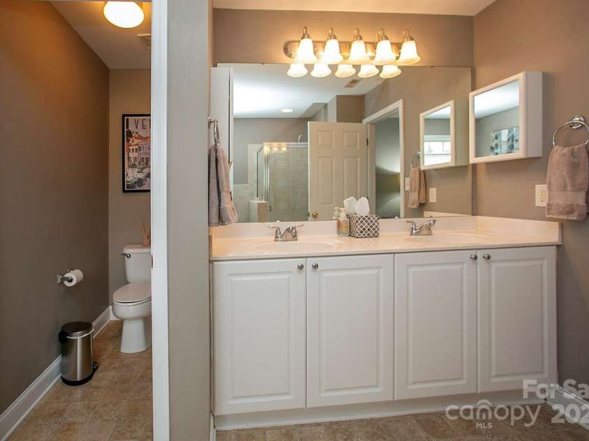 3015 Semmes Lane, Indian Trail, NC 28079.  MLS# CAR4284326, YatesRealty ID 30875. Tall dual vanities and a water closet make getting ready in the mornings WAY easier.
