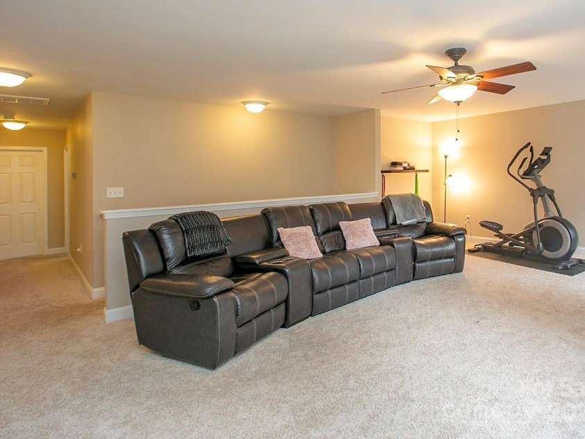 3015 Semmes Lane, Indian Trail, NC 28079.  MLS# CAR4284326, YatesRealty ID 30875. The loft is 23 feet by 16 feet, easily can hold a pool table if you want, too.