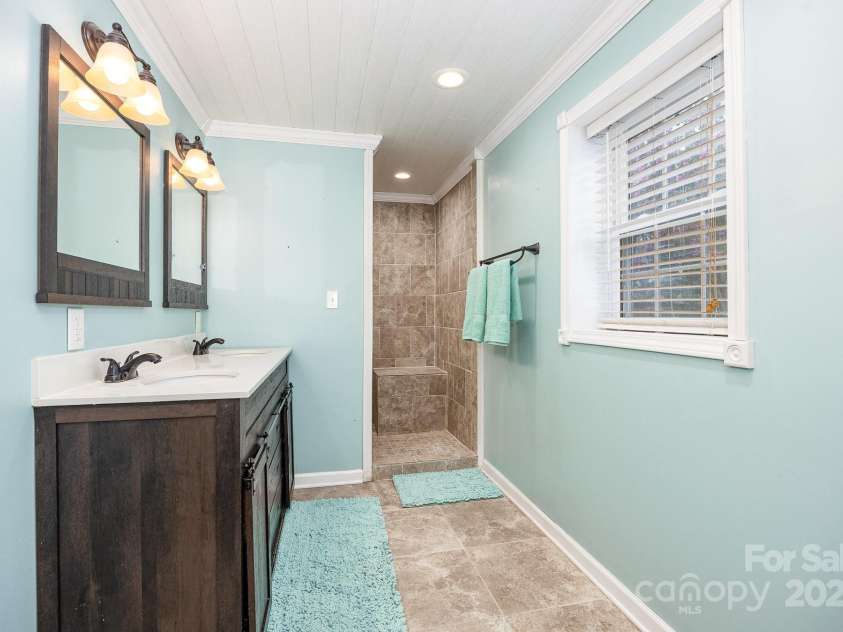 951 Helmstetler Road, Lexington, NC 27295.  MLS# CAR4276742, YatesRealty ID 30876. Main Primary Suite Bath w/ Roman shower