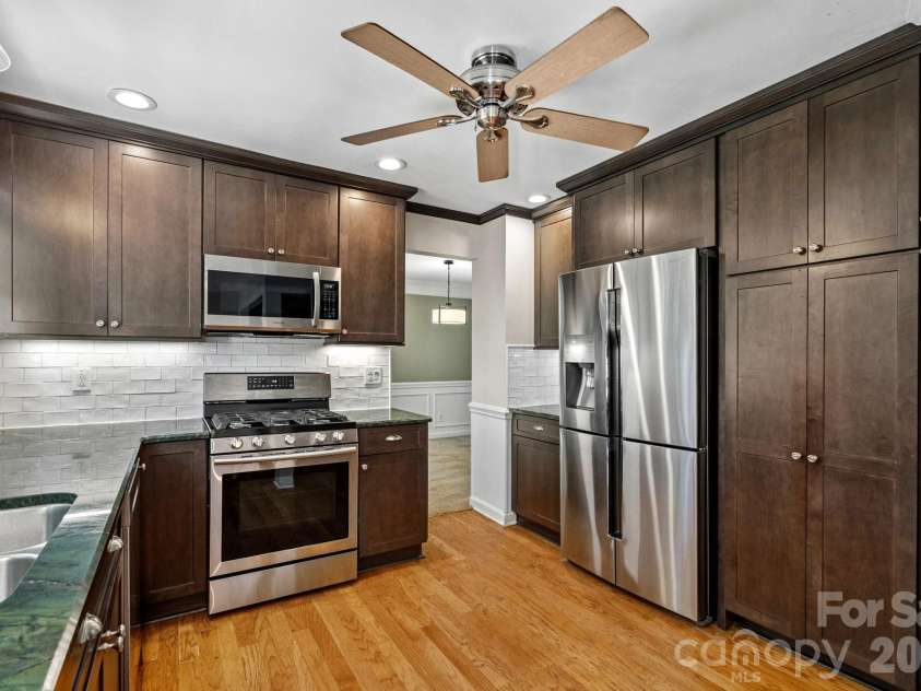 9037 Willow Trace Court, Huntersville, NC 28078.  MLS# CAR4387697, YatesRealty ID 30879. Kitchen with path to dinning just beyond