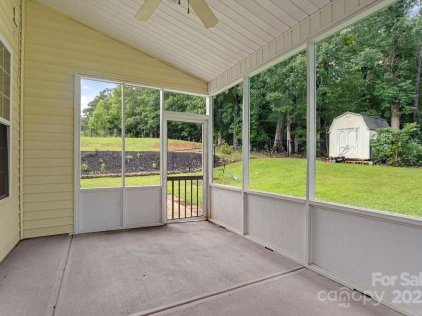 395 Lone Tree Lane, Clover, SC 29710.  MLS# CAR4288295, YatesRealty ID 30882. Screened-in Back Porch