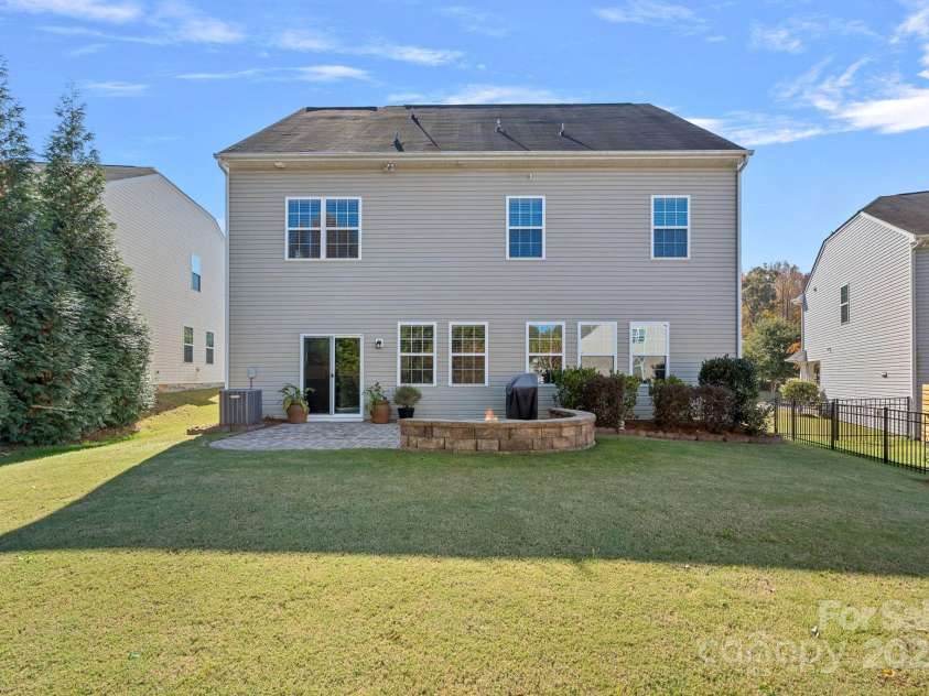 1349 Bridgeford Drive, Huntersville, NC 28078.  MLS# CAR4320318, YatesRealty ID 30883. Back view of home and yard