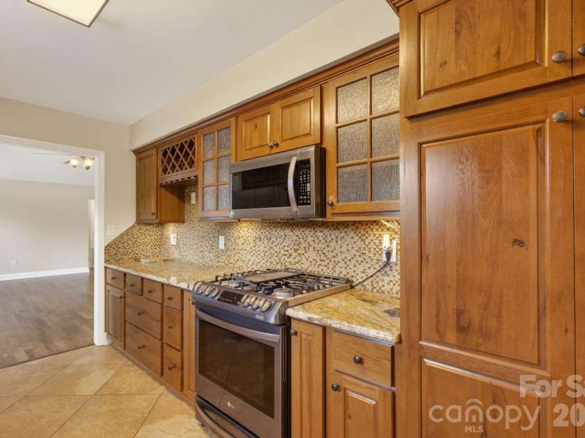 97 Whippoorwill Lane, Fairview, NC 28730.  MLS# CAR4377999, YatesRealty ID 30887. Beautiful Alder cabinets