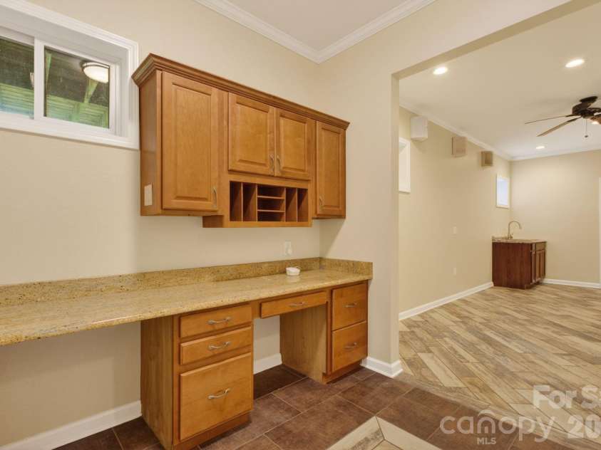 97 Whippoorwill Lane, Fairview, NC 28730.  MLS# CAR4377999, YatesRealty ID 30887. Lower level desk area