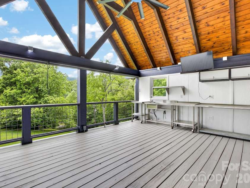 97 Whippoorwill Lane, Fairview, NC 28730.  MLS# CAR4377999, YatesRealty ID 30887. Timber frame deck with outdoor kitchen area