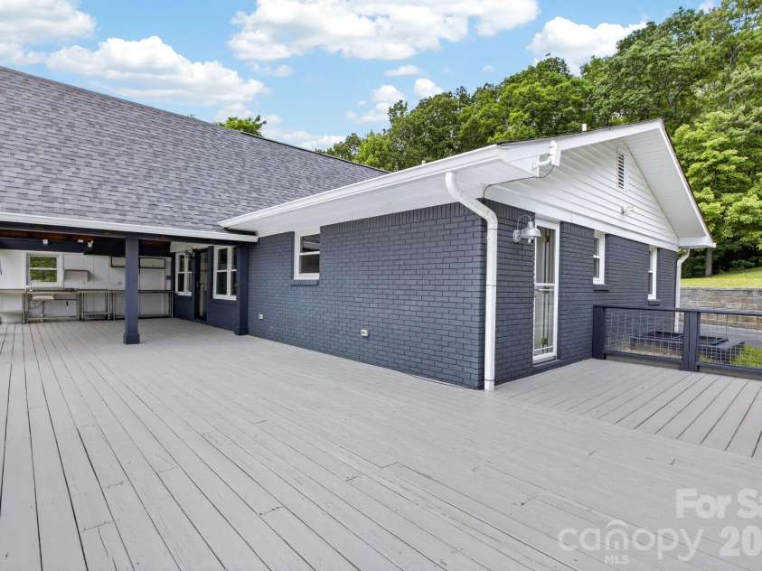 97 Whippoorwill Lane, Fairview, NC 28730.  MLS# CAR4402332, YatesRealty ID 30887. Large deck for entertaining