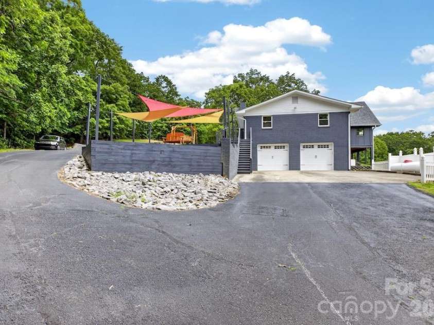 97 Whippoorwill Lane, Fairview, NC 28730.  MLS# CAR4402332, YatesRealty ID 30887. Lower garage parking main house