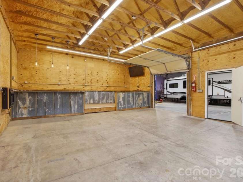 97 Whippoorwill Lane, Fairview, NC 28730.  MLS# CAR4402332, YatesRealty ID 30887. Second work shop with heat