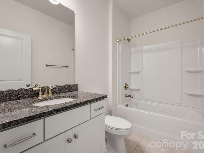 2015 Saddlebred Drive, Iron Station, NC 28080.  MLS# CAR4338671, YatesRealty ID 3089. Full bath main level, outside guest room