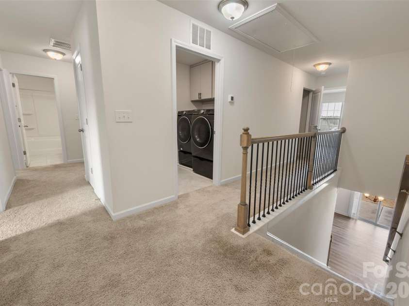 2015 Saddlebred Drive, Iron Station, NC 28080.  MLS# CAR4338671, YatesRealty ID 3089. Hallway upstairs, laundry room with upgraded w/d included