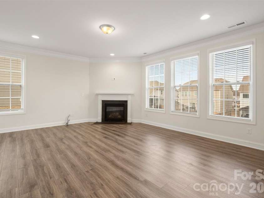 2015 Saddlebred Drive, Iron Station, NC 28080.  MLS# CAR4338671, YatesRealty ID 3089. Living room with gas fireplace