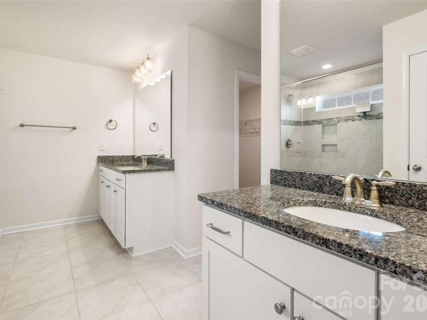 2015 Saddlebred Drive, Iron Station, NC 28080.  MLS# CAR4338671, YatesRealty ID 3089. Owner's Bath with His ad Hers Dual Vanities