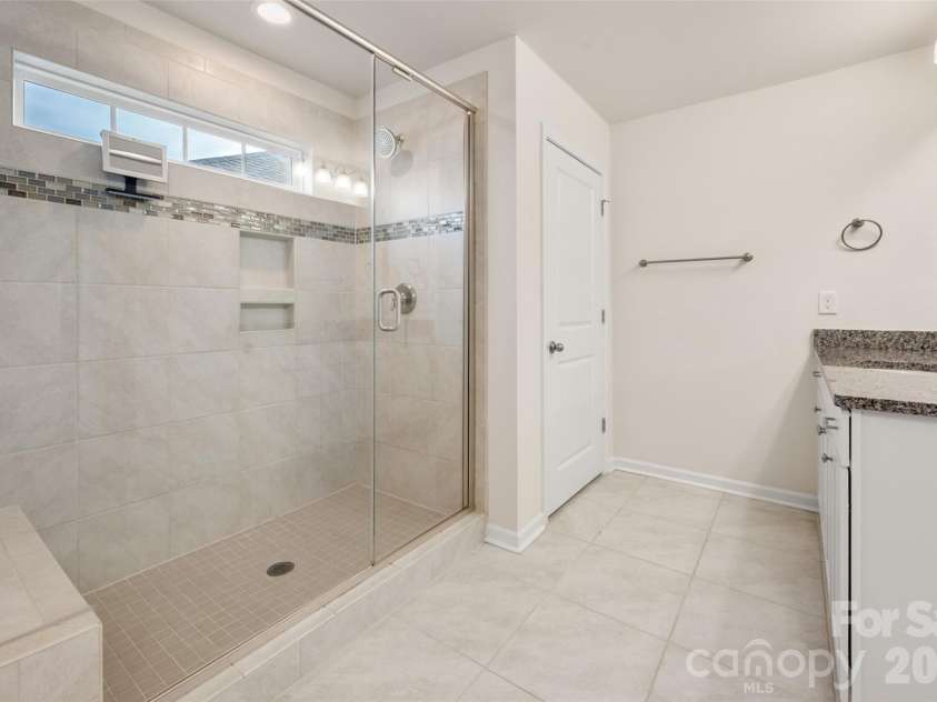 2015 Saddlebred Drive, Iron Station, NC 28080.  MLS# CAR4338671, YatesRealty ID 3089. Owner's bath with large walk in shower and water closet