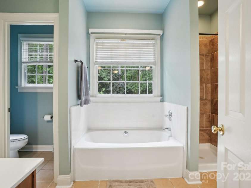 134 Lake Spring Loop, Mooresville, NC 28117.  MLS# CAR4307045, YatesRealty ID 30892. Large Primary Bath with Garden Tub