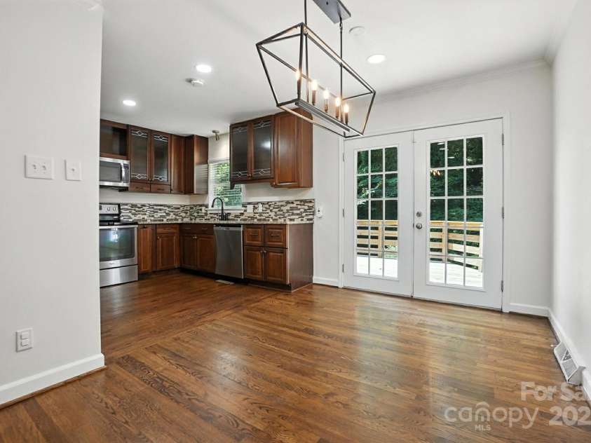 2528 Arnold Drive, Charlotte, NC 28205.  MLS# CAR4277706, YatesRealty ID 30895. Dining and double doors to back deck