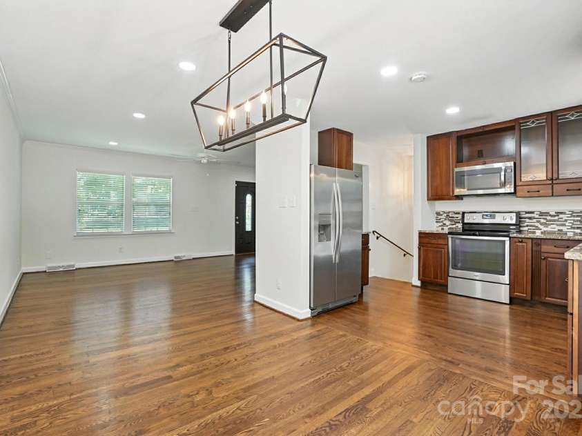 2528 Arnold Drive, Charlotte, NC 28205.  MLS# CAR4277706, YatesRealty ID 30895. Dining, living room, kitchen