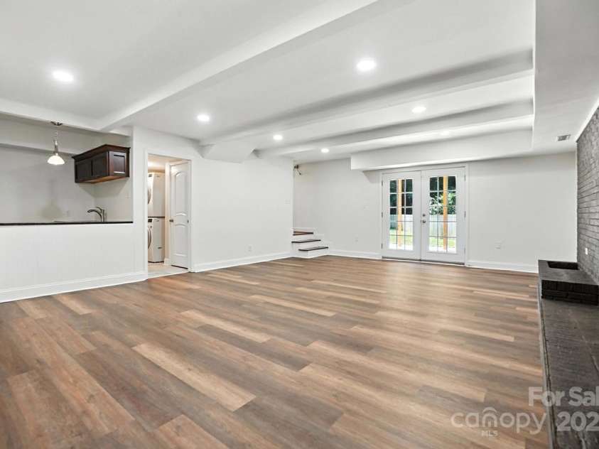 2528 Arnold Drive, Charlotte, NC 28205.  MLS# CAR4277706, YatesRealty ID 30895. Doors leading to downstairs patio