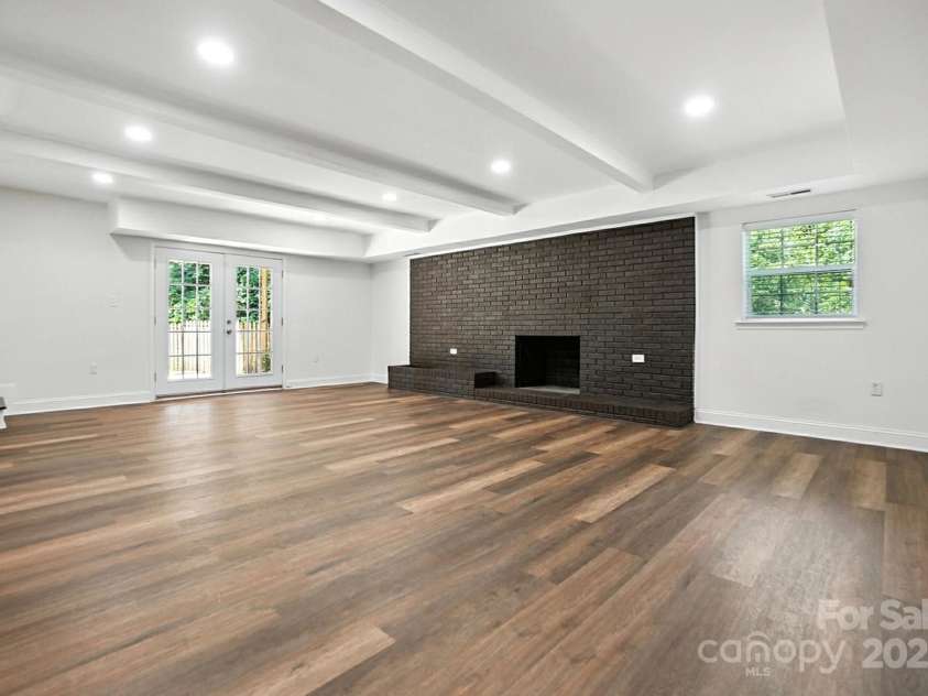 2528 Arnold Drive, Charlotte, NC 28205.  MLS# CAR4277706, YatesRealty ID 30895. Expansive family room downstairs