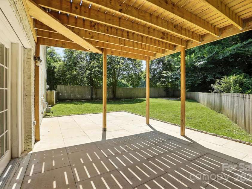 2528 Arnold Drive, Charlotte, NC 28205.  MLS# CAR4277706, YatesRealty ID 30895. Travertine patio down