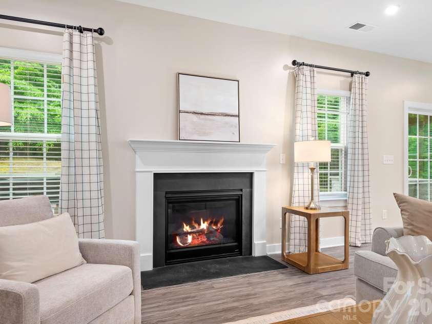 9233 Hollow Bend Drive, Huntersville, NC 28078.  MLS# CAR4379138, YatesRealty ID 30897. Fireplace flanked by 2 windows