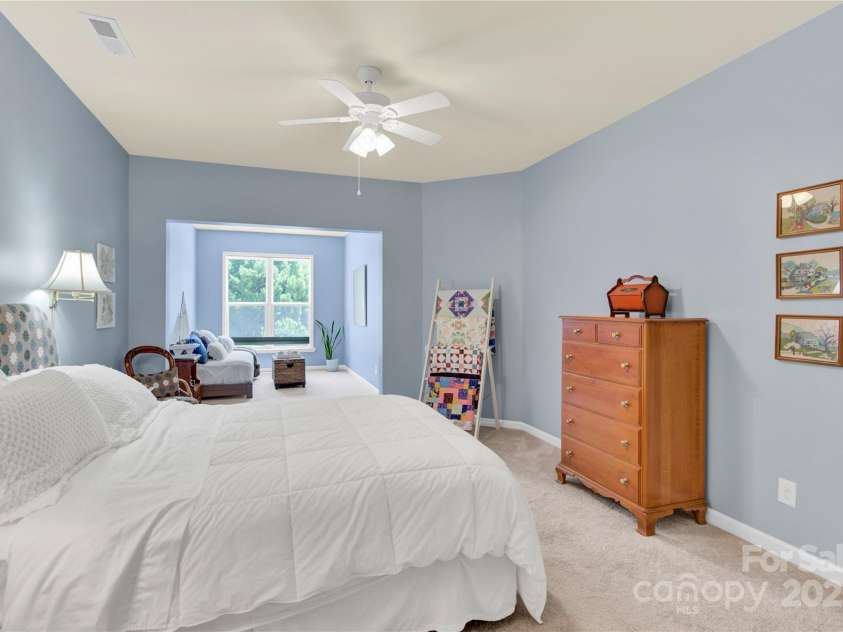 7028 Kitty Hawk Lane, Fort Mill, SC 29707.  MLS# CAR4285011, YatesRealty ID 30903. 3rd Bedroom - large and spacious with an additional sitting area.